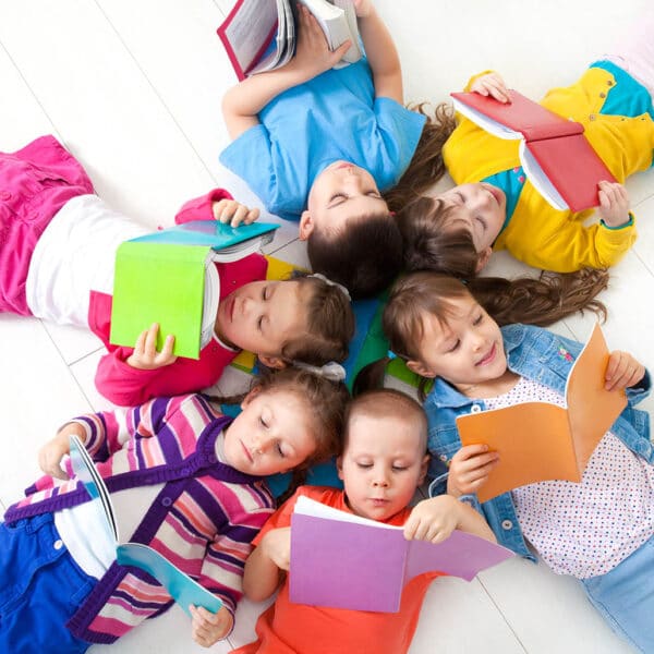 Group of children enjoying reading together